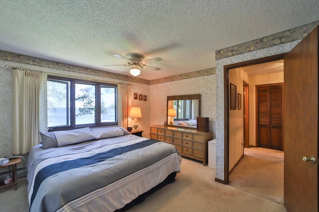 2072 Bluebill Ln SW, Nisswa, MN 56468 - bedroom featuring multiple windows, wallpapered walls, light carpet, a textured ceiling, and a ceiling fan
