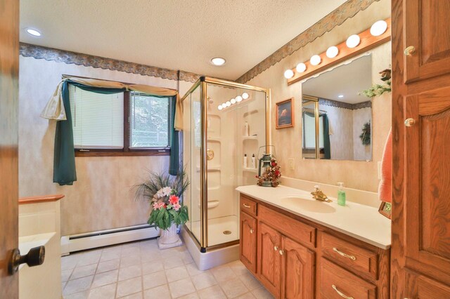 2072 Bluebill Ln SW, Nisswa, MN 56468 - bathroom featuring baseboard heating, a textured ceiling, vanity, a shower stall, and tile patterned floors