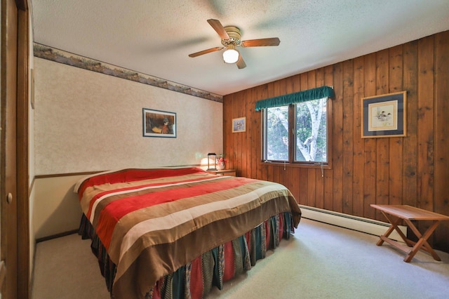 2072 Bluebill Ln SW, Nisswa, MN 56468 - bedroom with carpet floors, wooden walls, a textured ceiling, baseboards, and a ceiling fan