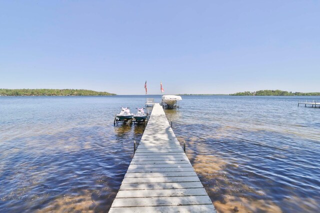 2072 Bluebill Ln SW, Nisswa, MN 56468 - dock featuring a water view and boat lift