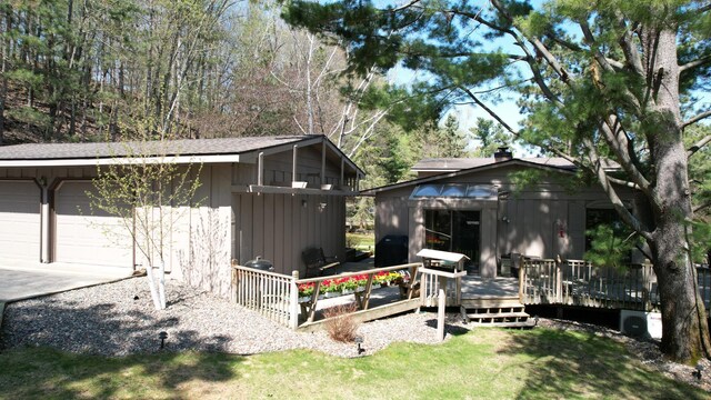 2072 Bluebill Ln SW, Nisswa, MN 56468 - back of property featuring a wooden deck and a garage