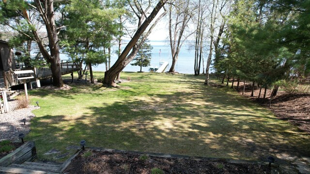 2072 Bluebill Ln SW, Nisswa, MN 56468 - view of green lawn with a deck with water view