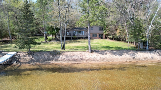 2072 Bluebill Ln SW, Nisswa, MN 56468 - view of front facade with a front lawn and a wooden deck