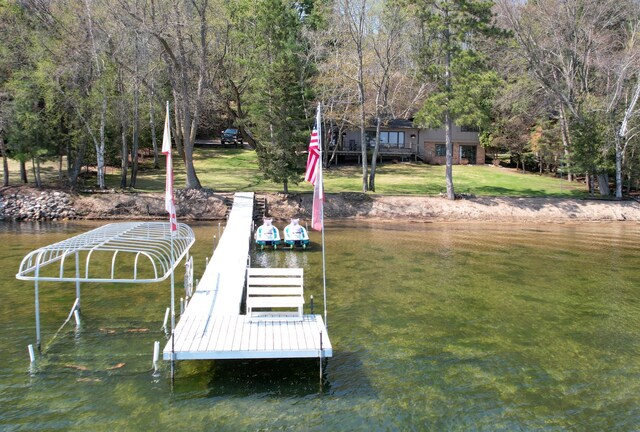 2072 Bluebill Ln SW, Nisswa, MN 56468 - dock featuring a water view and a lawn