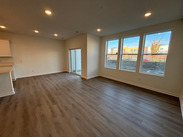 1763 Hauer Trl, Shakopee, MN 55379 - unfurnished living room with recessed lighting, dark wood finished floors, and baseboards