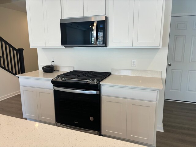 1763 Hauer Trl, Shakopee, MN 55379 - kitchen featuring gas stove, stainless steel microwave, dark wood finished floors, and white cabinets