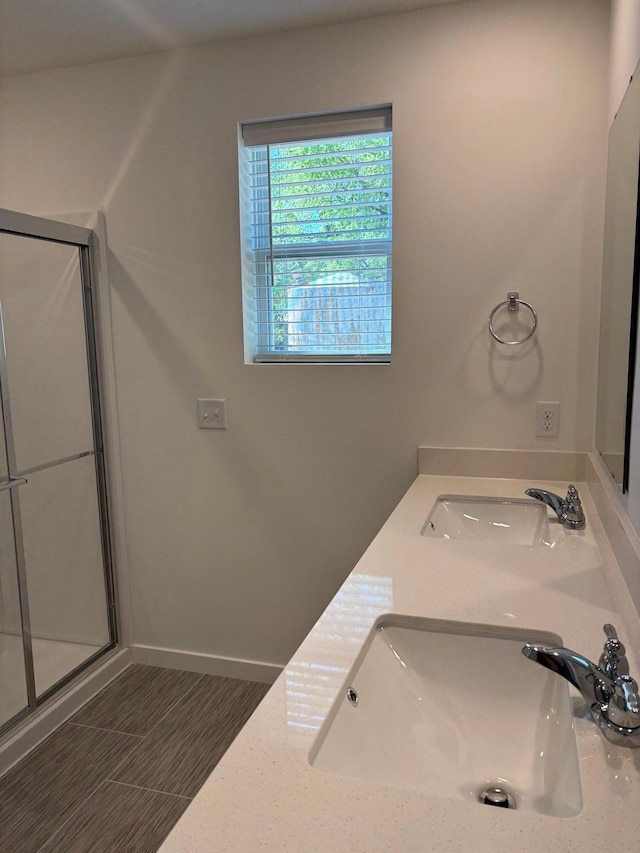 1763 Hauer Trl, Shakopee, MN 55379 - bathroom featuring a stall shower, double vanity, and baseboards