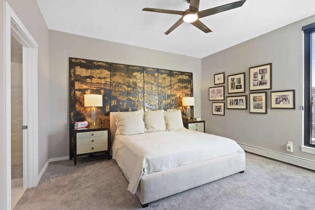 bedroom with baseboard heating, baseboards, ceiling fan, and carpet