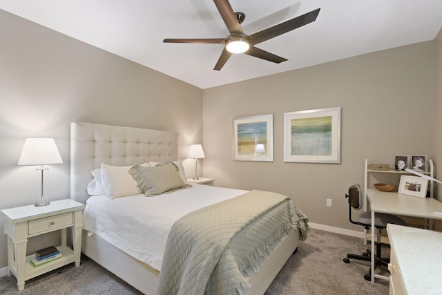 carpeted bedroom featuring a ceiling fan and baseboards