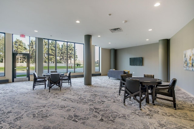 carpeted dining room with recessed lighting, visible vents, and expansive windows