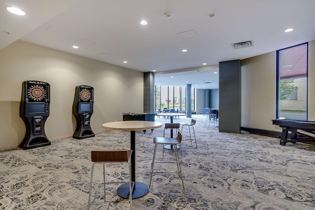 carpeted dining room featuring recessed lighting, baseboards, and visible vents