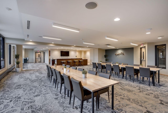 carpeted dining room with recessed lighting and visible vents