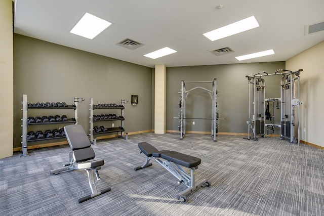 workout area with visible vents, carpet flooring, and baseboards