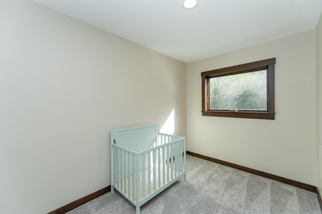 carpeted bedroom with baseboards