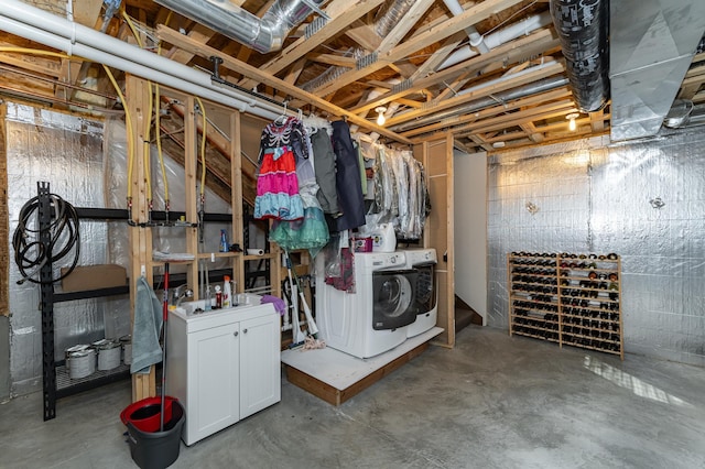 unfinished basement featuring washing machine and dryer