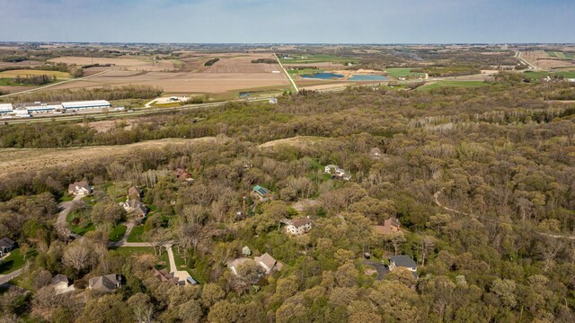aerial view of property's location featuring a forest