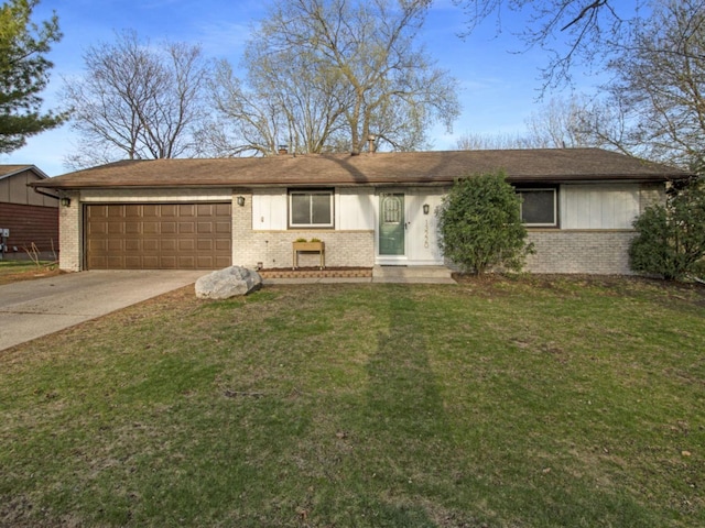 ranch-style home with brick siding, an attached garage, driveway, and a front yard