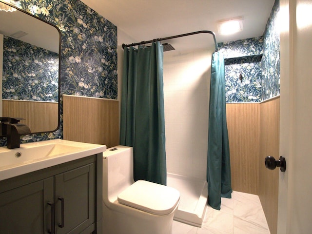 full bathroom featuring wainscoting, vanity, toilet, wallpapered walls, and a shower stall