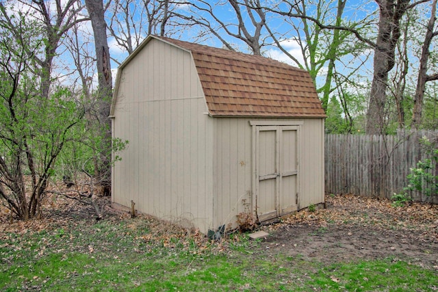 view of shed with fence