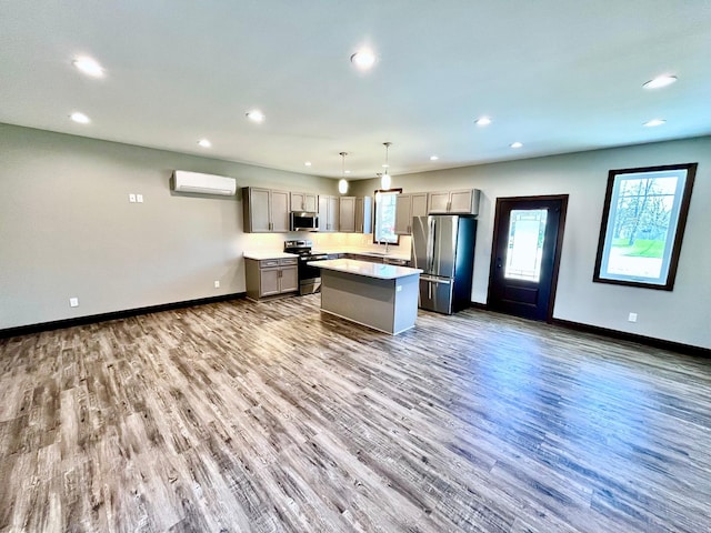 kitchen featuring gray cabinetry, appliances with stainless steel finishes, and recessed lighting