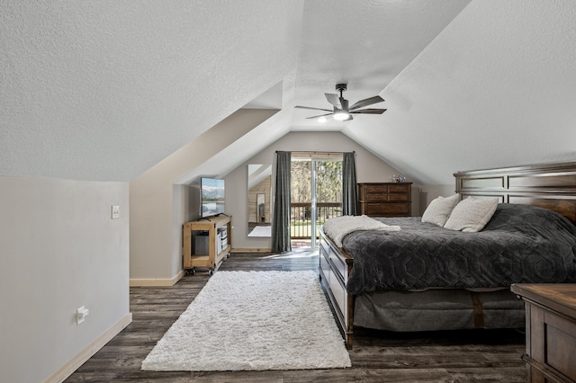 bedroom with a textured ceiling, baseboards, vaulted ceiling, dark wood-style flooring, and access to outside