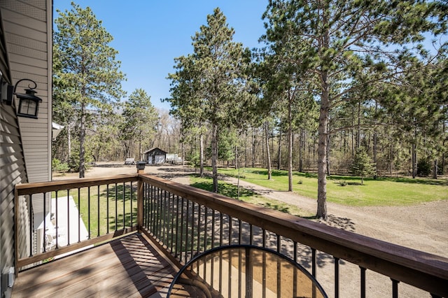 wooden terrace with a lawn