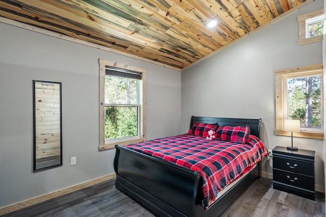 bedroom with multiple windows, wooden ceiling, and wood finished floors