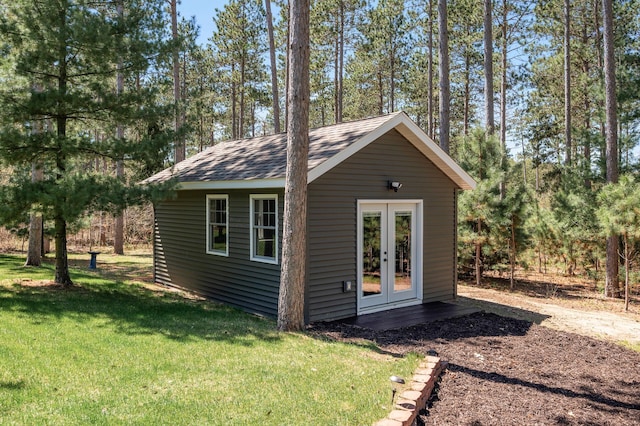 view of outbuilding featuring french doors and an outbuilding