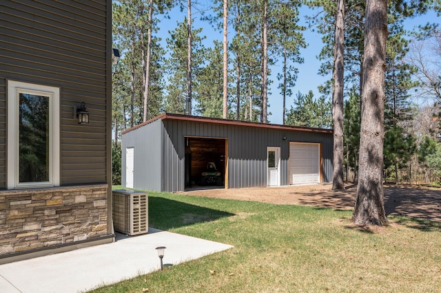 detached garage featuring central air condition unit