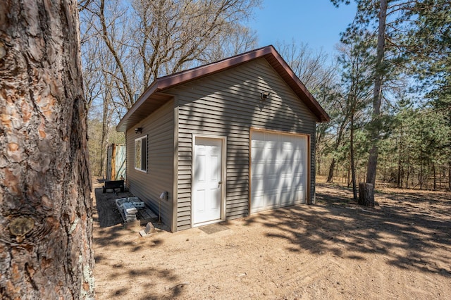 detached garage featuring driveway