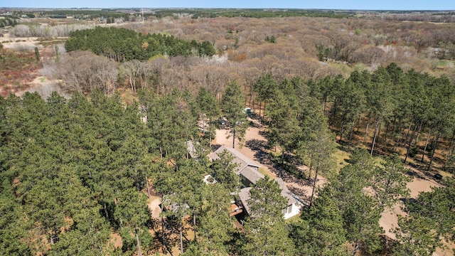 drone / aerial view featuring a view of trees