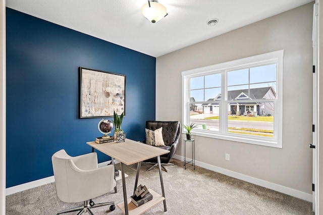 home office with baseboards and carpet