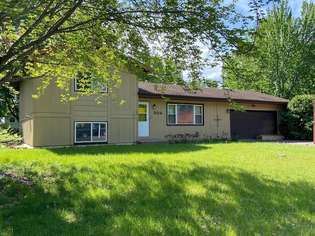 204 8th St N, Sartell, MN 56377 - view of front of home with a garage and a front yard