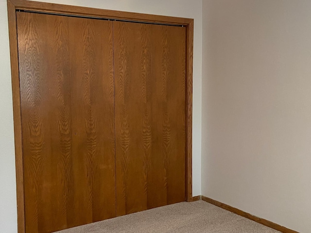 204 8th St N, Sartell, MN 56377 - unfurnished bedroom featuring carpet, baseboards, and a closet