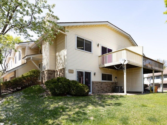 1042 Aston Cir, Burnsville, MN 55337 - rear view of house featuring brick siding, a yard, a chimney, and a wooden deck