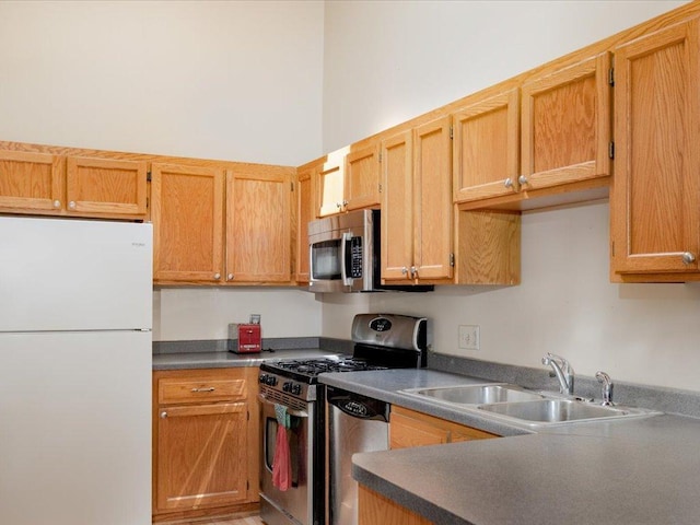 1042 Aston Cir, Burnsville, MN 55337 - kitchen with appliances with stainless steel finishes, a sink, and dark countertops