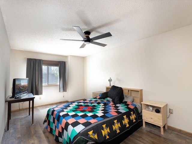 1042 Aston Cir, Burnsville, MN 55337 - bedroom with wood finished floors, a textured ceiling, a ceiling fan, and baseboards