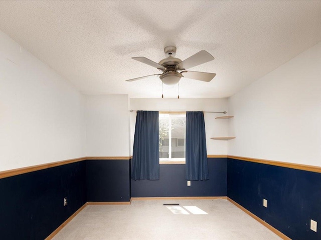 1042 Aston Cir, Burnsville, MN 55337 - spare room with carpet, ceiling fan, a textured ceiling, and baseboards