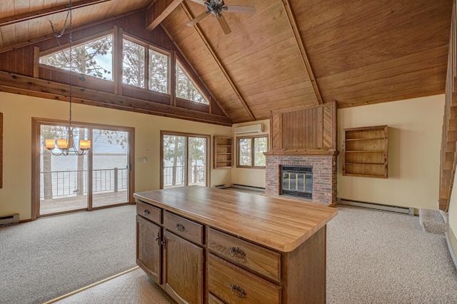10121 Comstock Rd, Hayward, WI 54843 - kitchen featuring wood ceiling with exposed beams, a baseboard radiator, light carpet, butcher block counters, and a wall unit AC
