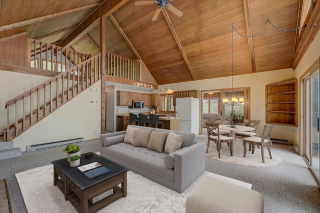 10121 Comstock Rd, Hayward, WI 54843 - living area with a baseboard heating unit, wood ceiling with exposed beams, high vaulted ceiling, light carpet, and stairway