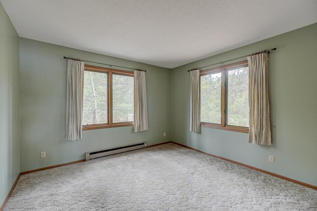 10121 Comstock Rd, Hayward, WI 54843 - empty room featuring baseboard heating, a textured ceiling, carpet flooring, and baseboards