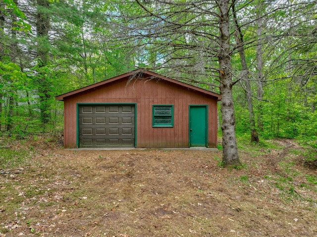 10121 Comstock Rd, Hayward, WI 54843 - detached garage with a view of trees