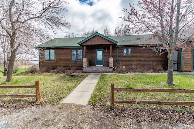 23898 324th Ave, Sverdrup Twp, MN 56586 - view of front facade with roof with shingles, a front lawn, fence, and crawl space