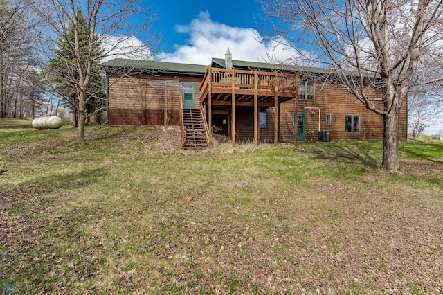 23898 324th Ave, Sverdrup Twp, MN 56586 - back of house featuring stairway, a wooden deck, central AC unit, and a lawn