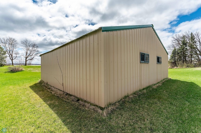 23898 324th Ave, Sverdrup Twp, MN 56586 - view of property exterior featuring a lawn, an outdoor structure, and a pole building