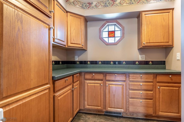 23898 324th Ave, Sverdrup Twp, MN 56586 - kitchen featuring brown cabinetry, dark countertops, and visible vents