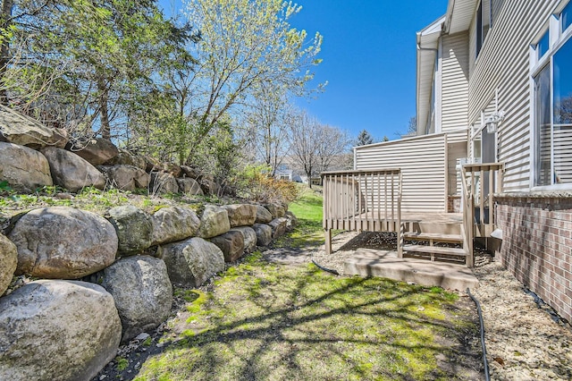 view of yard with a deck