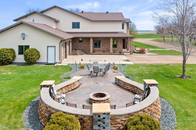 6435 172nd Ave SE, Colfax, ND 58018 - back of house with roof with shingles, a yard, an outdoor fire pit, and a patio area
