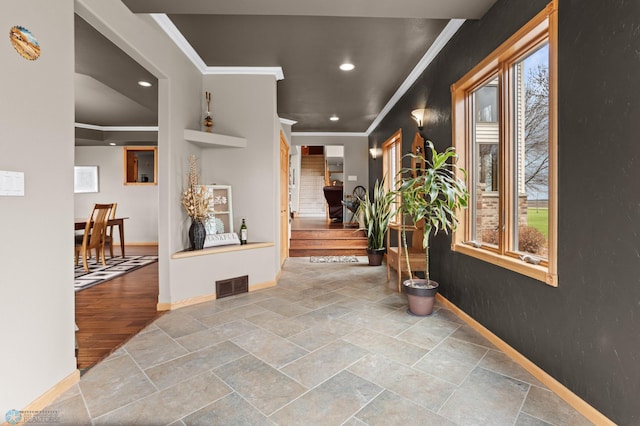 6435 172nd Ave SE, Colfax, ND 58018 - corridor with stone finish floor, recessed lighting, baseboards, visible vents, and ornamental molding