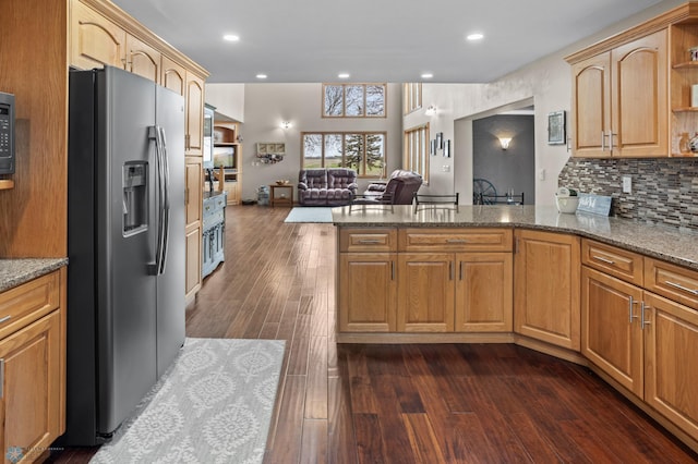 6435 172nd Ave SE, Colfax, ND 58018 - kitchen with stone countertops, open floor plan, a peninsula, and stainless steel fridge with ice dispenser